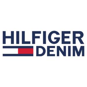 Logotipo da marca Hilfiger Denim, apresentando o nome em letras grandes e azul, com um detalhe em vermelho e uma linha vertical estilizada, representando a estética casual e moderna da moda denim.